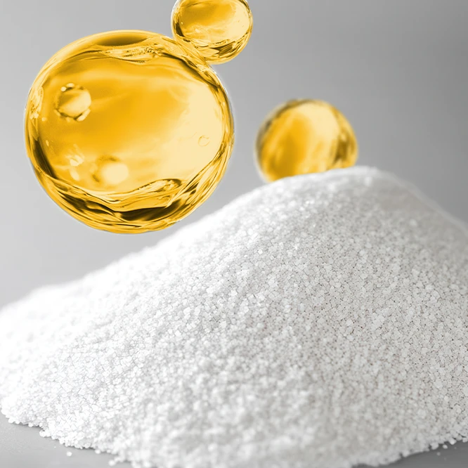 Golden beads and white powder on a gray background (Photo)