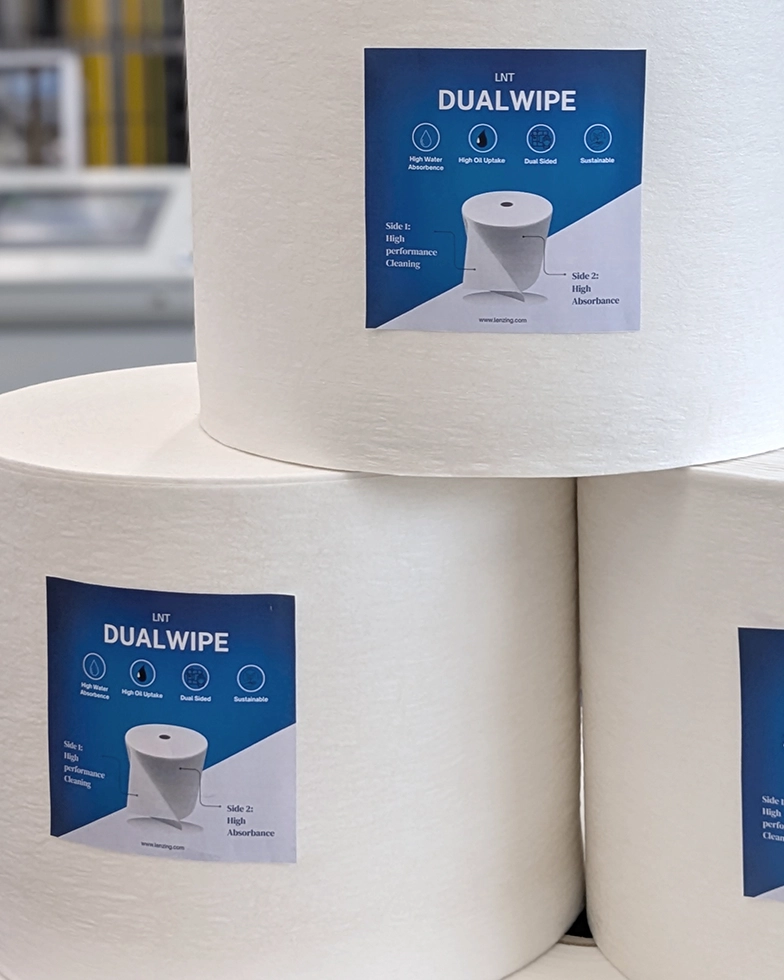 Three large white rolls of nonwoven fabric (Photo)